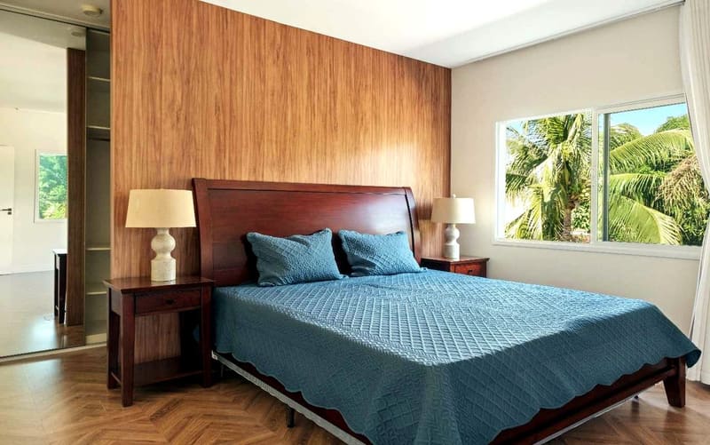 Suite with a wood-panelled wall