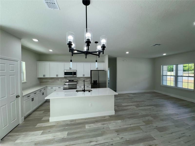 Kitchen with island and pendant lighting