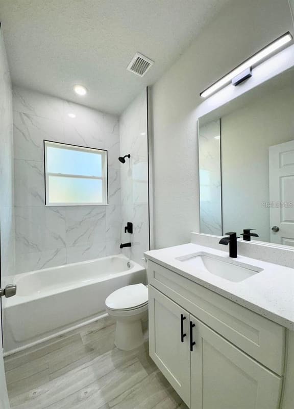 Guest bathroom with tub