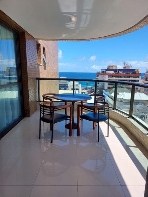 Balcony with dining set and ocean view