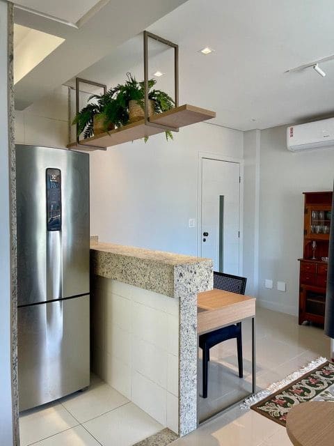 Kitchen entry with stainless steel refrigerator