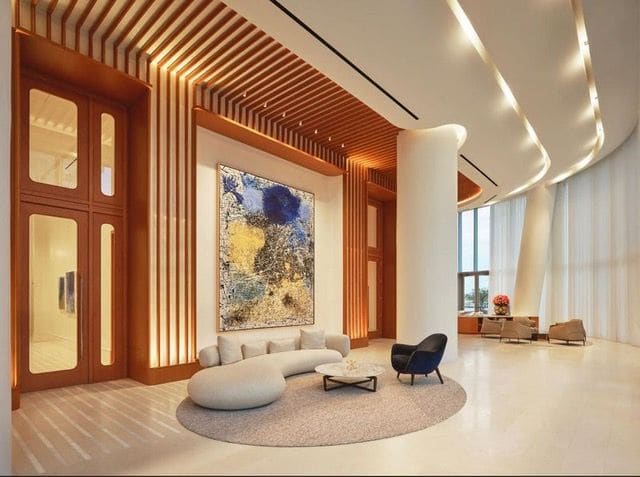 Lobby with wood-panelled walls and art