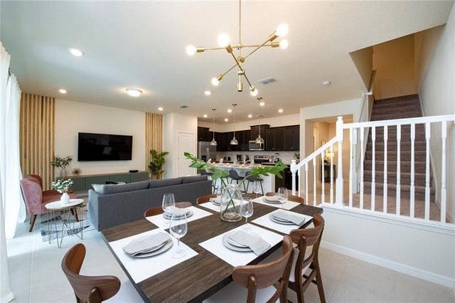 Dining and living area with the staircase