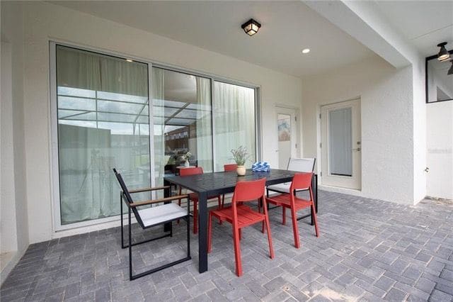 Covered lanai dining beside the pool